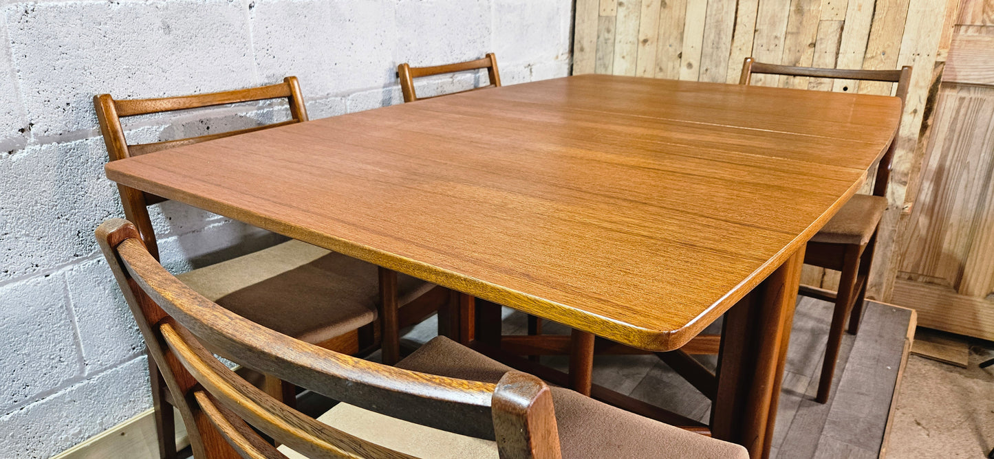 Mid century teak McIntosh drop leaf table and 4 teak chairs.