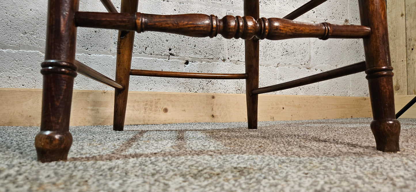 Early 1900s Elm captains chair.